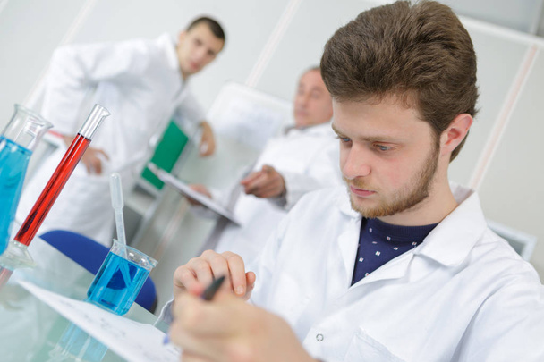 young male scientist or graduate student in lab - Fotó, kép