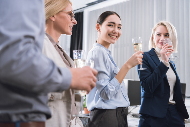 business colleagues with glasses of champagne - 写真・画像