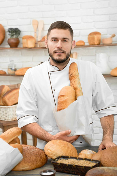 Professional baker at his store - Fotó, kép