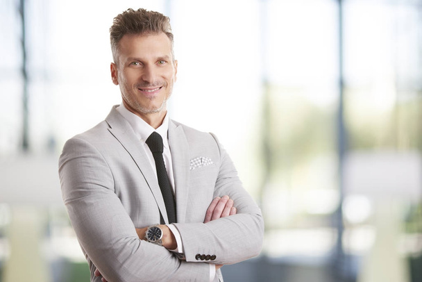 businessman standing with arms crossed - Photo, Image