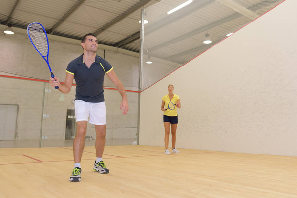 man playing squash and squash - Φωτογραφία, εικόνα