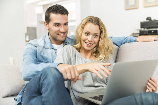 Young couple making the most of new technologies in their house - Photo, image