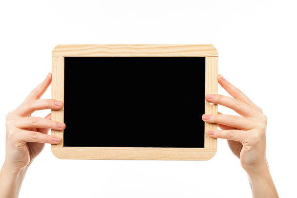 female hand holding blackboard   - Foto, afbeelding