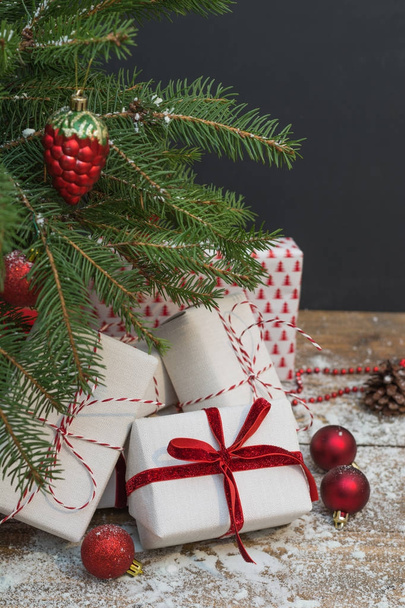 Christmas holiday background. Gifts under christmas tree. - Foto, afbeelding