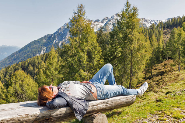 Woman have a rest in Alps landscape, Western Carinthia, Austria. - Foto, imagen