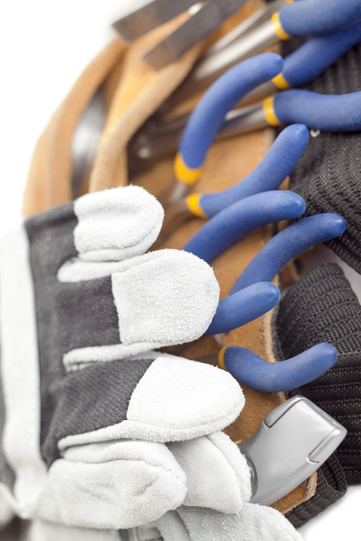 Макроизображение инструментального пояса и ручных перчаток
 - Фото, изображение