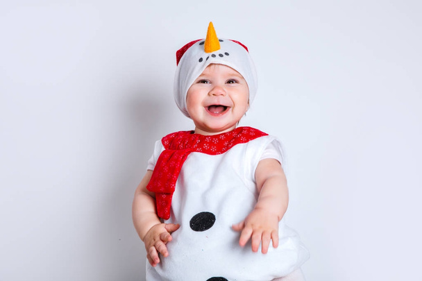 merry christmas and happy new year. happy baby in snowman costume - Фото, изображение