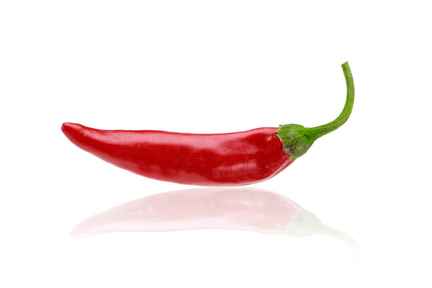 red hot chili pepper on white background with shadows - Фото, изображение