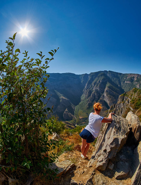 Young Woman at the edge of Mountain Gorge - Photo, Image