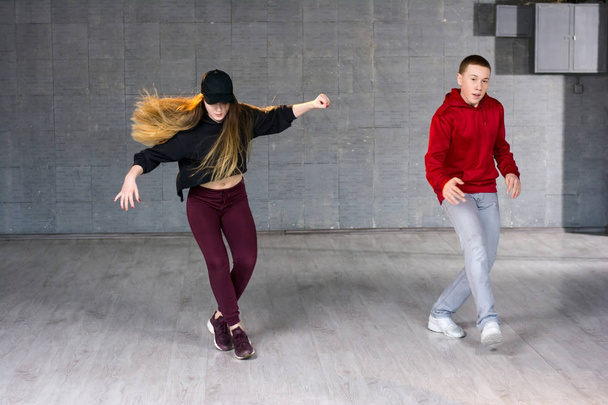 Couple of hip-hop dancers is dancing. - Photo, Image