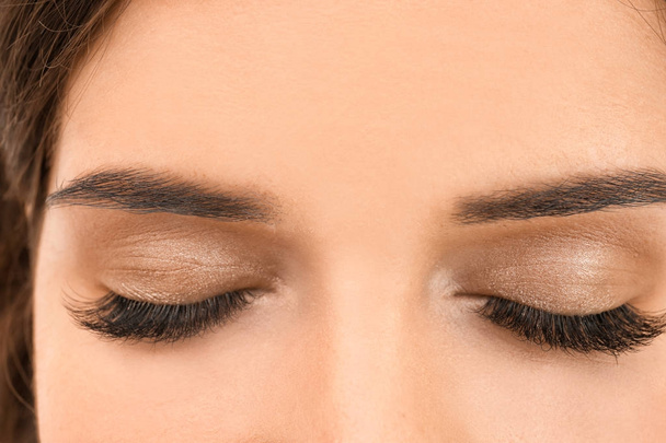 Beautiful young woman with eyelash extension, closeup - Fotó, kép