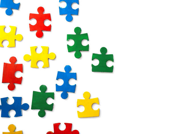 Pieces of colorful puzzle on white background - Fotografie, Obrázek