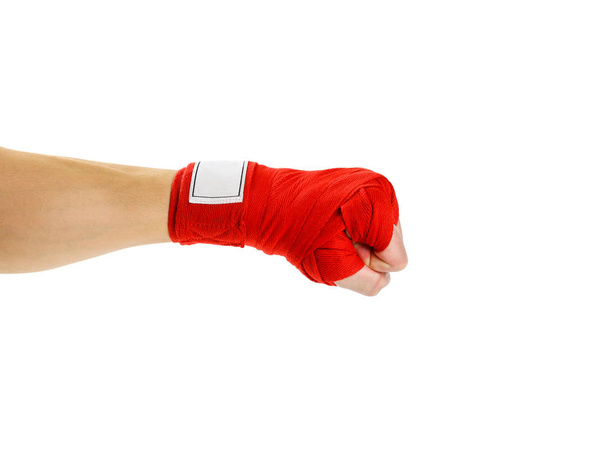 Hand in red Boxing bandages. Sports armband. Isolated on white b - Photo, image
