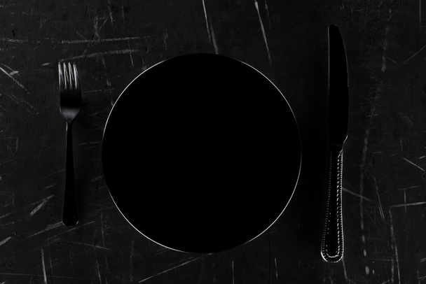 plate with fork and knife - Фото, зображення