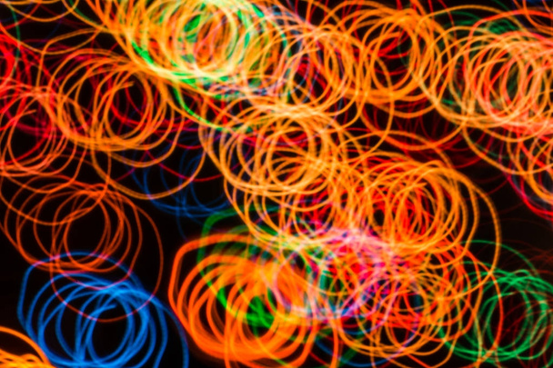 Abstract background with lights in blurred motion in the night or fireworks in new years eve - Foto, imagen