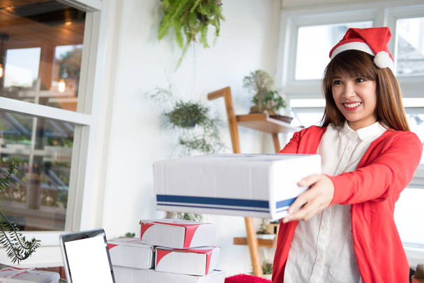 startup small business owner holding parcel box at workplace. wo - Photo, Image