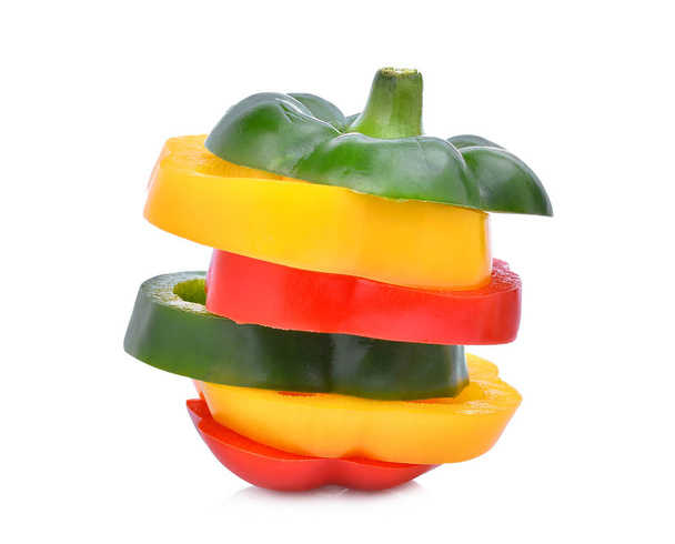 colorful slice of sweet bell pepper or capsicum isolated on whit - Zdjęcie, obraz