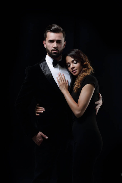 portrait of fashion couple on black background - Foto, imagen