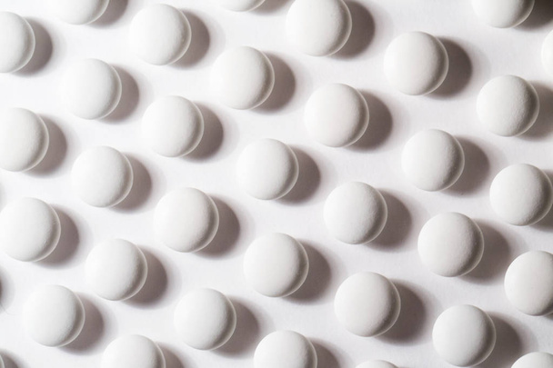 White pills. Background. - Фото, изображение