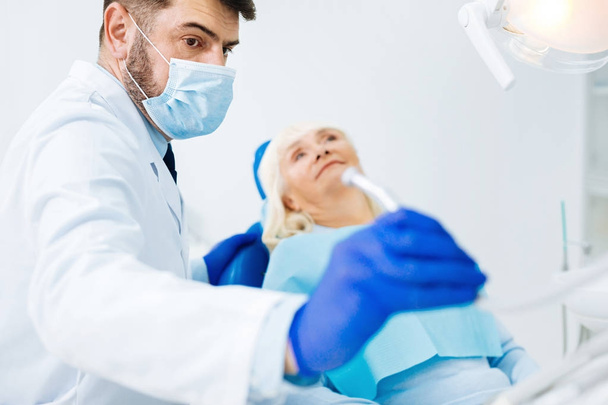Close up of professional dentist with instrument - Photo, Image