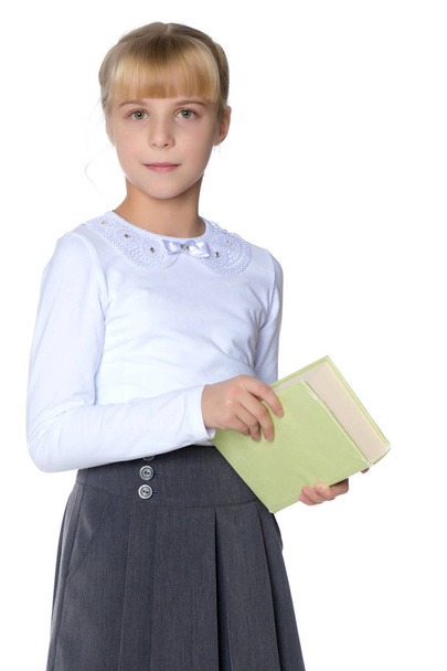 Little girl with a book - Φωτογραφία, εικόνα