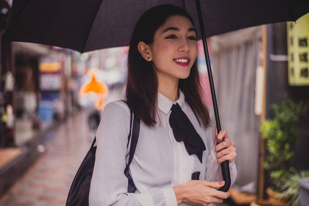 Beautiful japanese girl walking in Tokyo. Concept about teenager - Zdjęcie, obraz