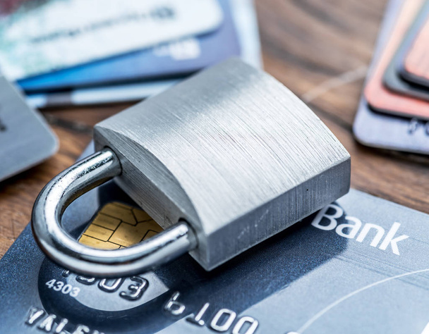 Credit cards and simle mechanical lock. - Fotó, kép
