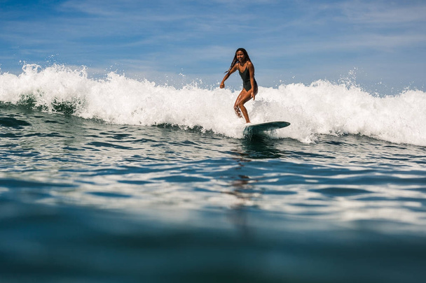 female surfer on surf board - Fotografie, Obrázek
