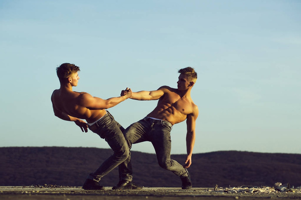 Twin men or bodybuilders wrestling - Zdjęcie, obraz