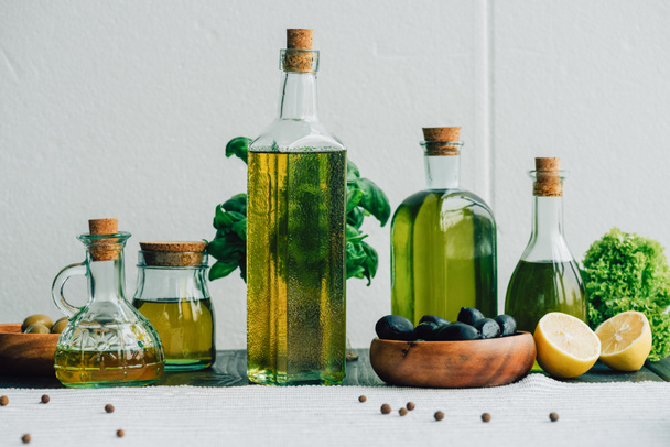 olive oil bottles with vegetables - Photo, Image