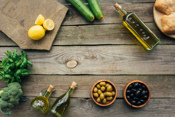 olive bottles on table - Fotoğraf, Görsel