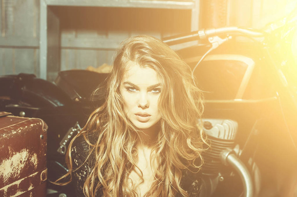 Sexy fashion model sitting at metallized motorcycle - Фото, зображення