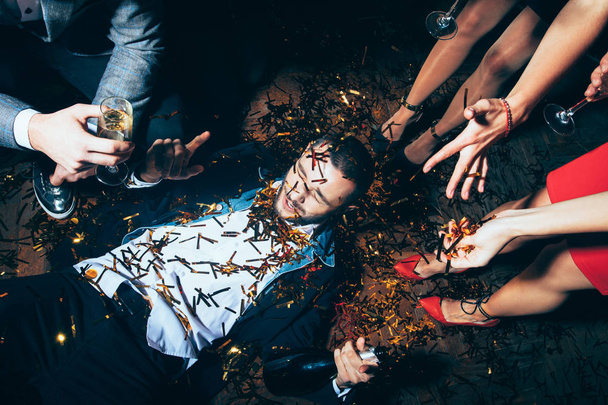 drunk man lying on floor - Photo, Image