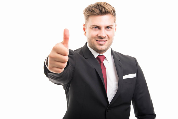Portrait of handsome corporate business man showing thumb up - Foto, Bild