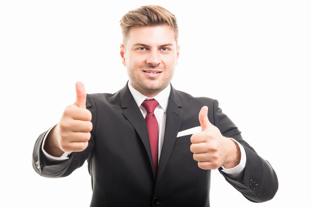 Portrait of handsome corporate business man showing thumbs up - Foto, Imagen