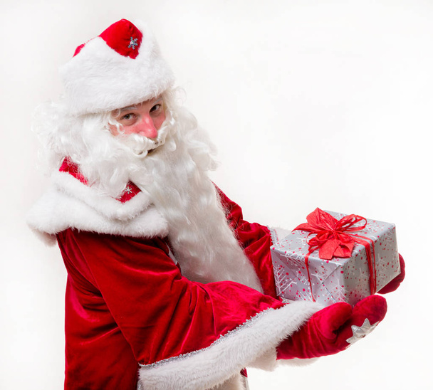 Santa Claus with gift - Фото, зображення