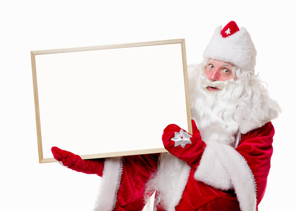 Kerstman met grote wit bord  - Foto, afbeelding