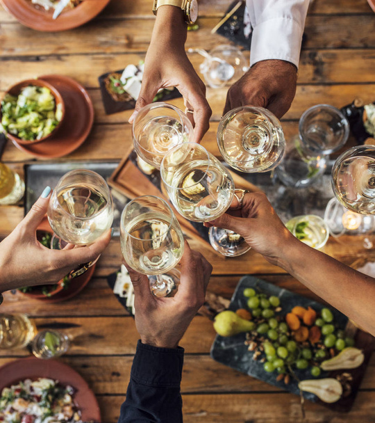 Friends Toasting at Dinner Party - Photo, image