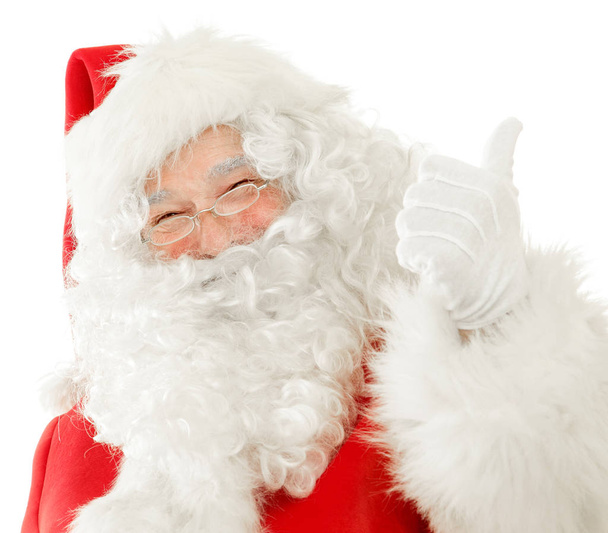 Happy Santa Claus giving the Thumbs Up while cutely smiling, Isolated on White Background cut out - Photo, Image