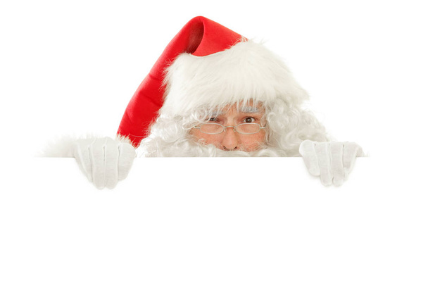 Serie de Santa Claus aislado en White Cut out: Sostener un cartel vacío jugando peekaboo, Expresión Preocupada
 - Foto, imagen
