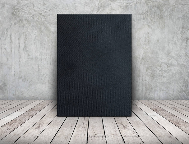 Blank long black fabric canvas frame leaning at concrete wall on - Φωτογραφία, εικόνα
