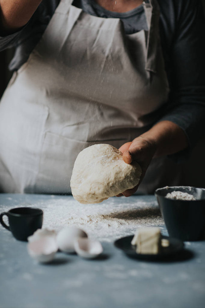 Woman working with dough. - Φωτογραφία, εικόνα