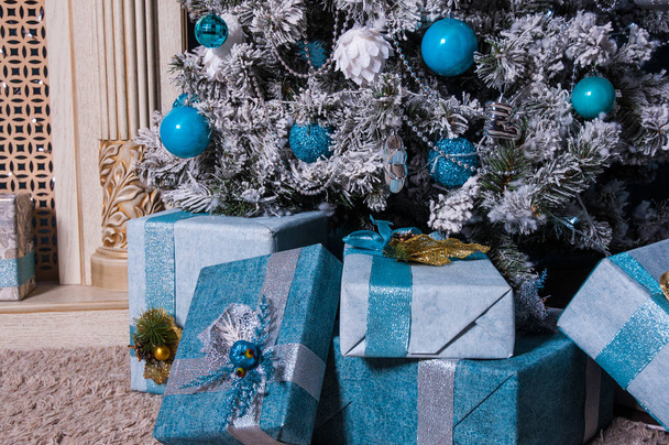 Presents and Gifts under Christmas Tree, Winter Holiday Concept - Valokuva, kuva