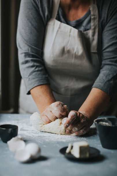 Woman working with dough. - Foto, Imagem