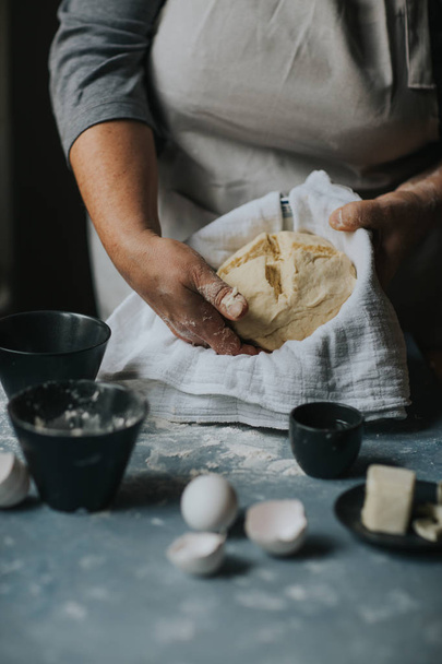 Woman working with dough. - Foto, immagini