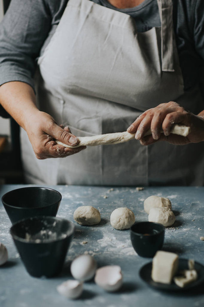Woman working with dough. - Photo, Image