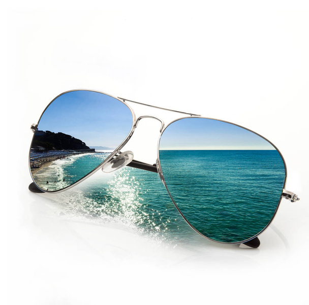 sunglasses with sea on white background - 写真・画像