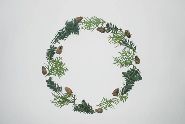 Christmas round frame of natural branches and pines. New year border with copy space. Winter wreath. Flat lay, top view. - Φωτογραφία, εικόνα