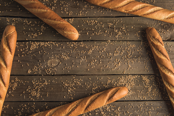 baguettes and grains on table - Photo, image
