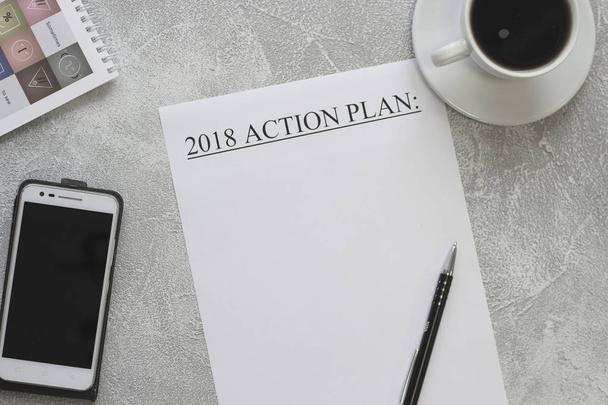 2018 action plan paper, mobile phone and a cup of coffee - Foto, Imagem
